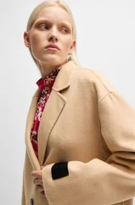 Abrigo largo oversize fit con cierre cruzado