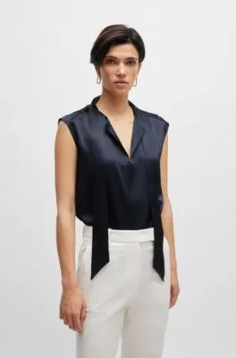 Blusa de seda sin mangas con lazo en el cuello