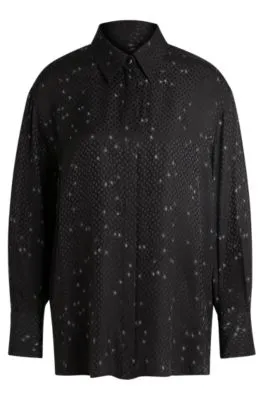 Blusa holgada con estampado y jacquard de puntos