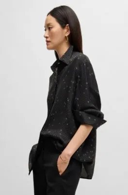 Blusa holgada con estampado y jacquard de puntos