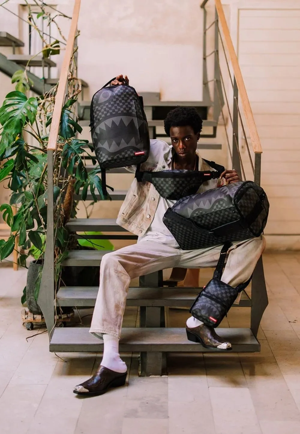 Bolso sprayground negro handover drip check sling