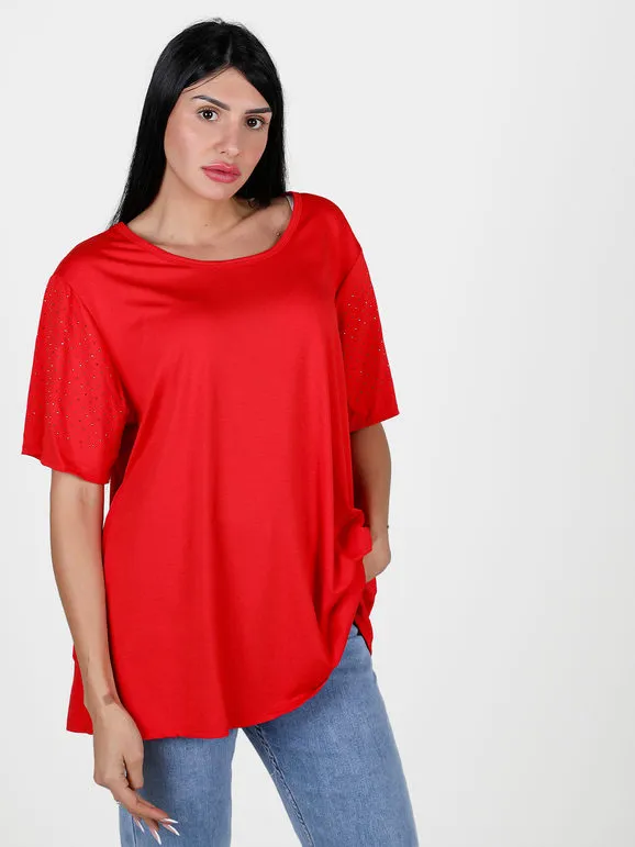 Solada Maxi camiseta de mujer con pedrería en las mangas.