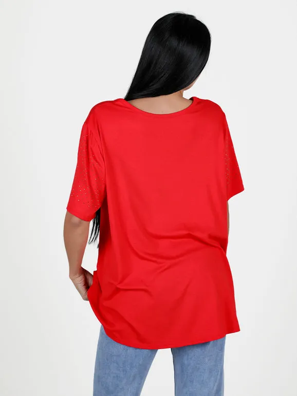 Solada Maxi camiseta de mujer con pedrería en las mangas.